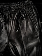 LEATHER TRACK PANTS